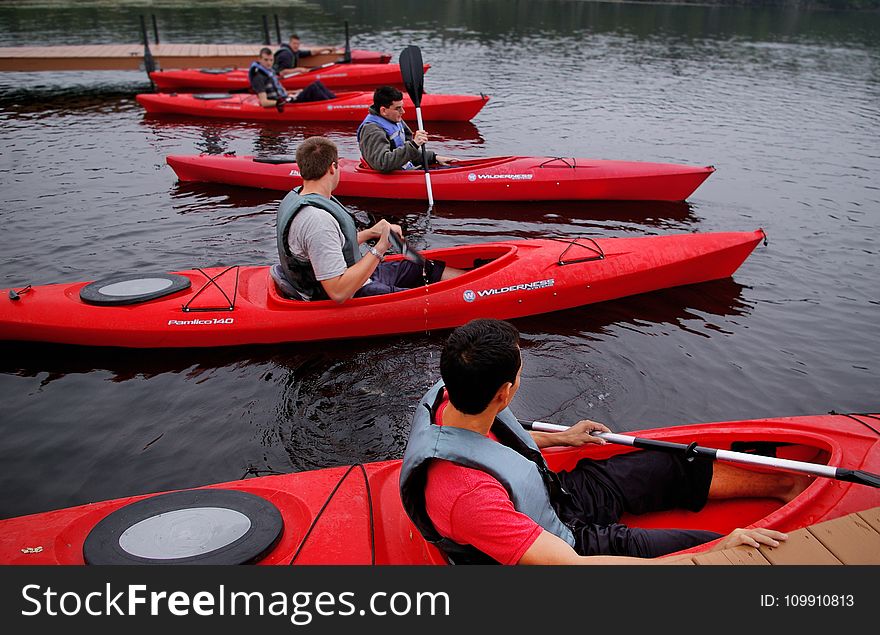 People Riding Kayaks