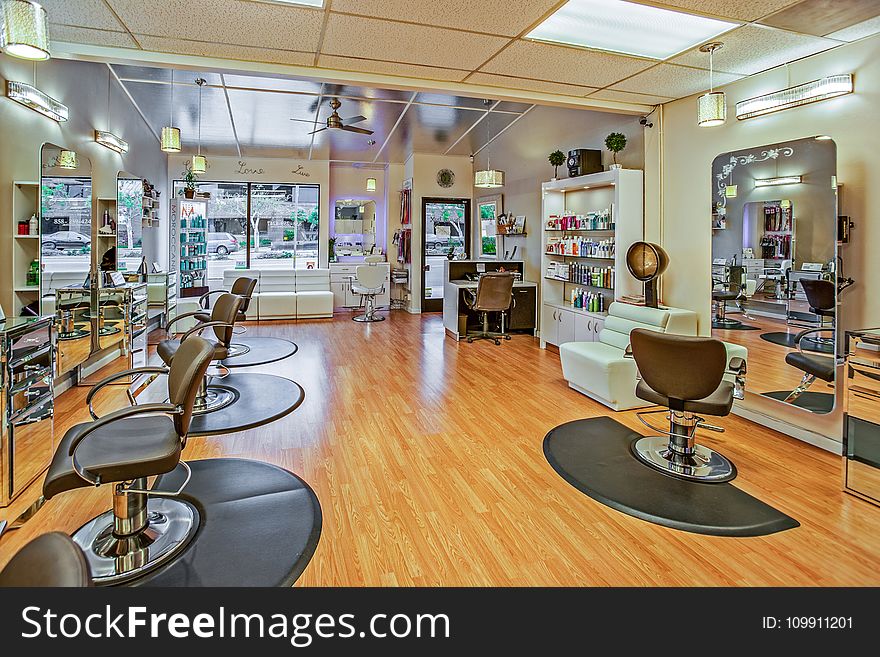 White And Brown Chairs Inside A Salon