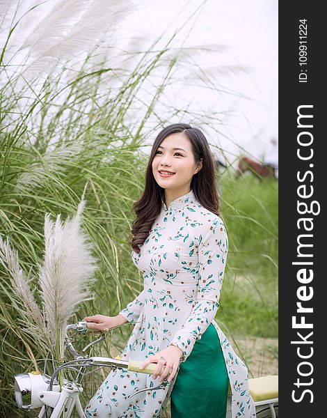 Woman Riding Beach Cruiser Bicycle