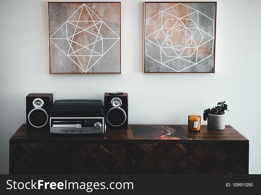 Black Shelf Stereo on Brown Wooden Sideboard