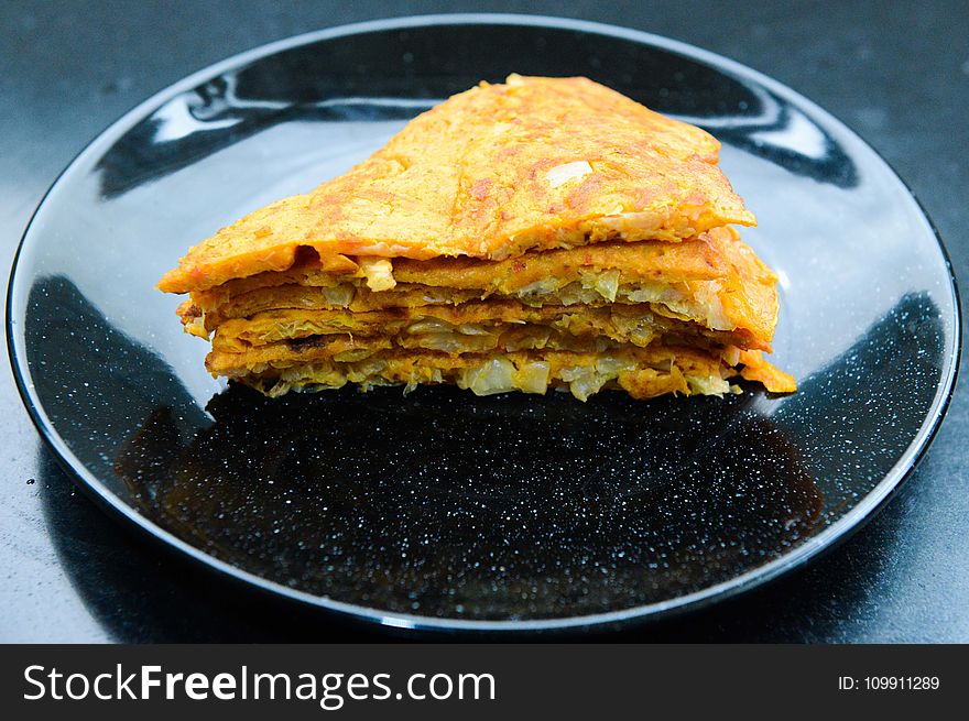 Stack of Pancakes On Round Black Ceramic Plate