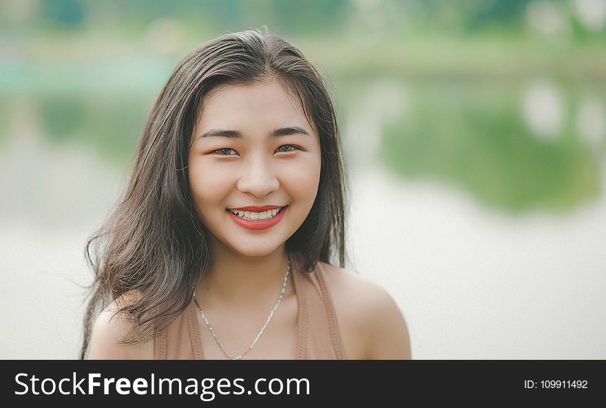 Close-Up Photography of A Girl Smiling