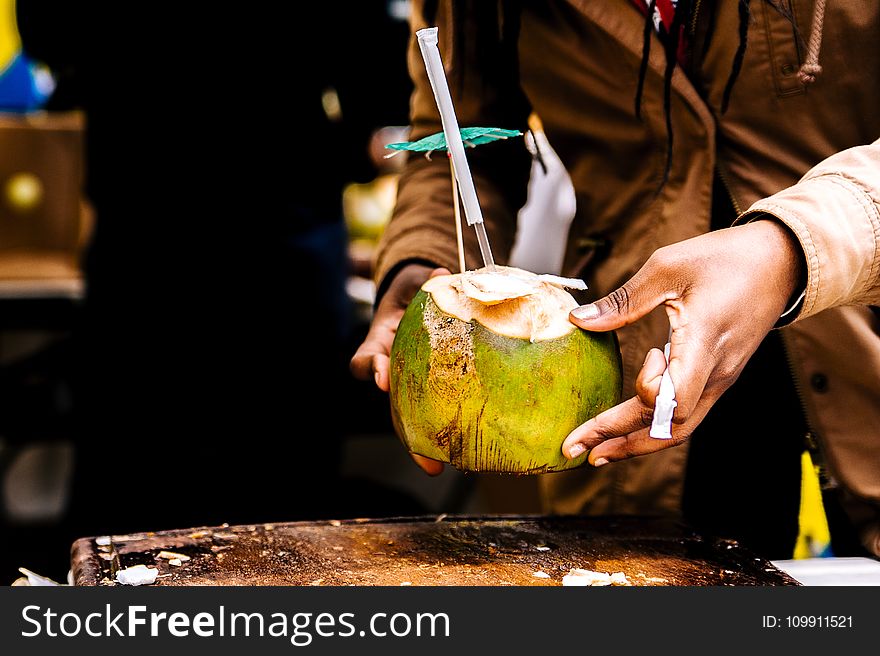 Person Holding Coconut