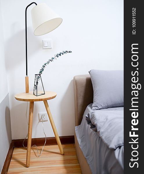 White Shade Table Lamp Near Bed
