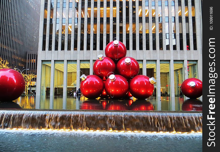 Red Baubles Near Grey High-rise Building
