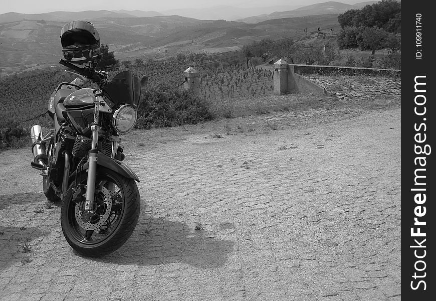 Grayscale Photo of Standard Motorcycle