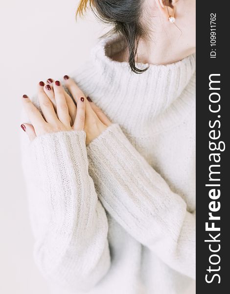 Woman Wearing Turtleneck Sweater in White Surface