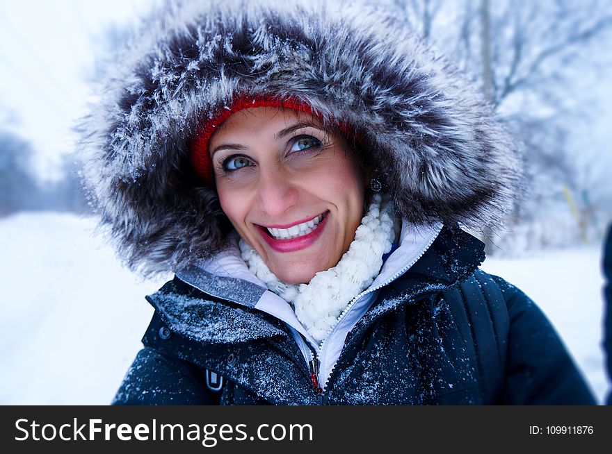 Close Up Photo of Woman Wearing Black Zip-up Parka Coat during Snow Season