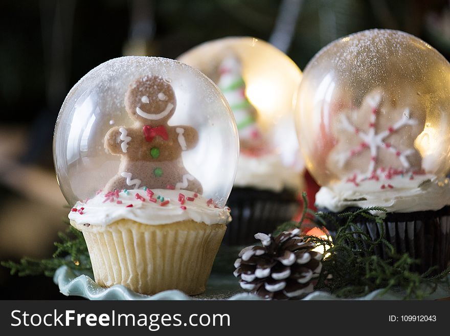 Three Christmas-themed Glass Snow Globes