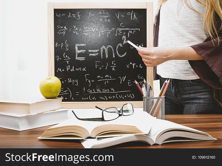 Woman Illustrating Albert Einstein Formula