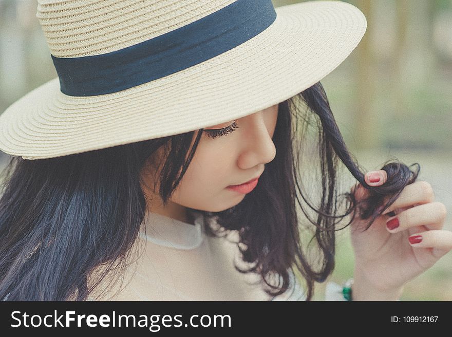 Selective Focus Photography Of Woman With Brown Sun Hat