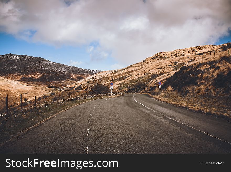 Concrete Road Near Mountains