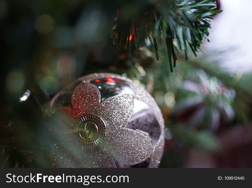 Silver Christmas Bauble Hanging on Christmas Tree
