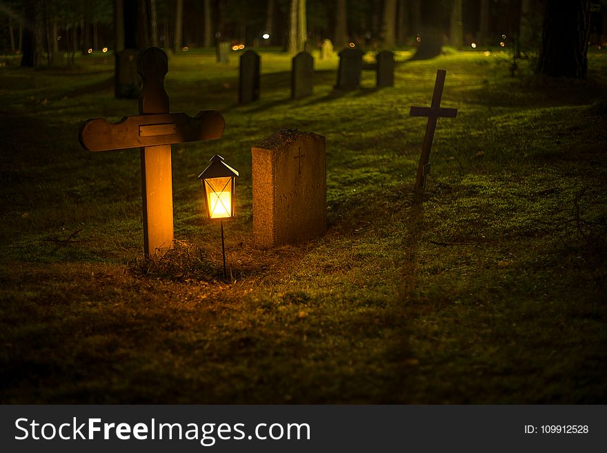 Selective Focus Photo of Cemetery Lantern