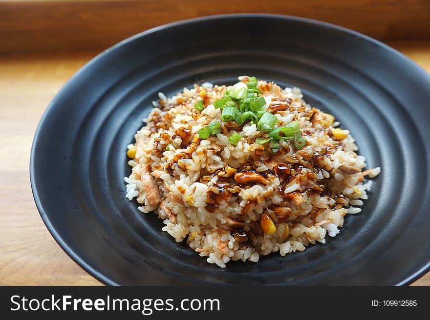 Cooked Rice on Black Ceramic Plate