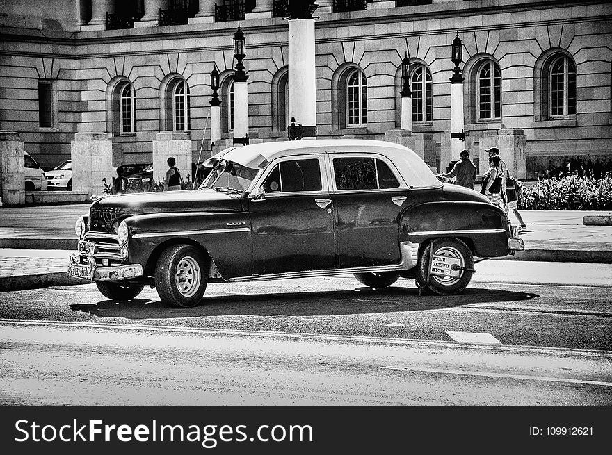 Grayscale Photo of Classic Chevrolet Sedan