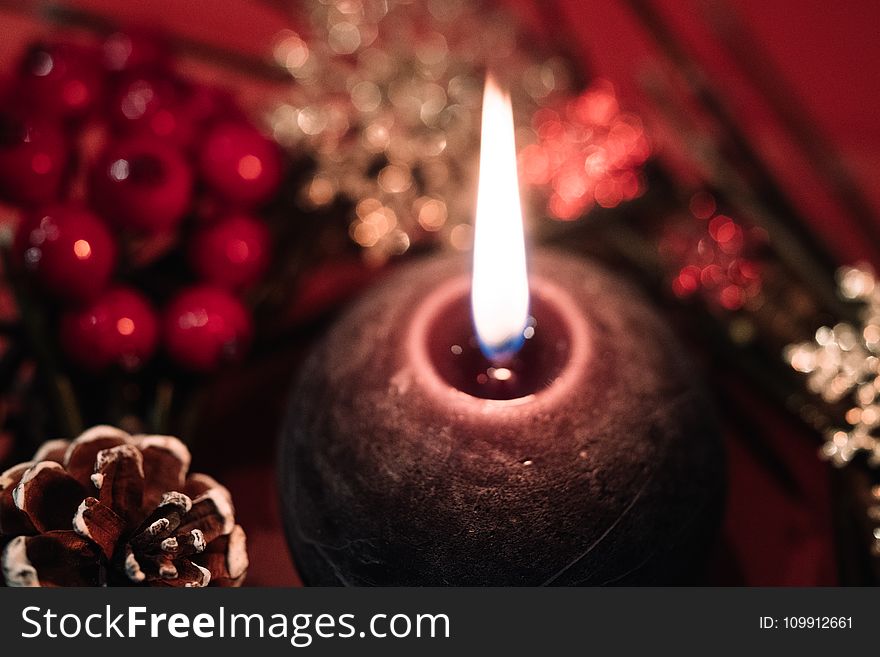 Lighted Black Round Candle