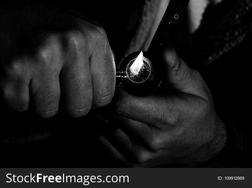 Photo Of Man Holding Lighter