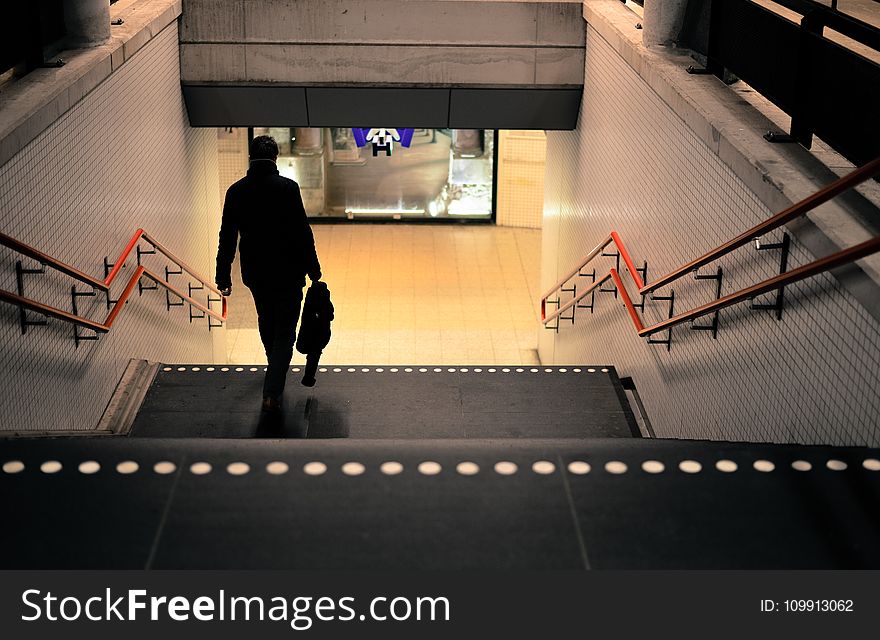 Photo Of Person Going Down The Stairs