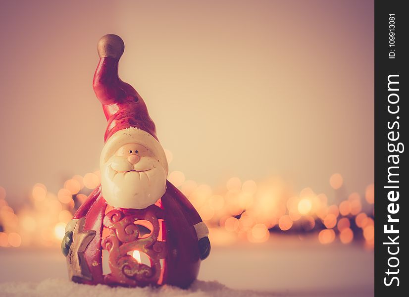 Shallow Focus Photography of Santa Claus Figurine