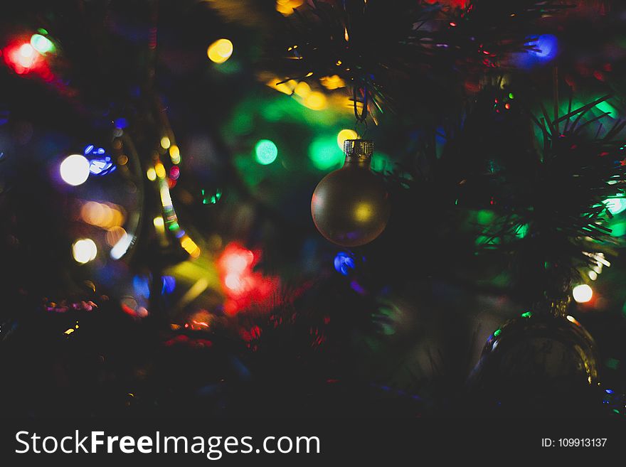 Closeup Photography of Christmas Bauble Hanging on Tree