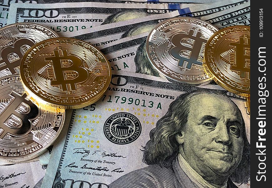 Bitcoins and U.s Dollar Bills