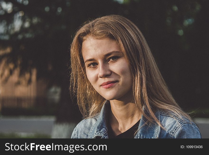 Woman Wearing Blue Denim Jacket