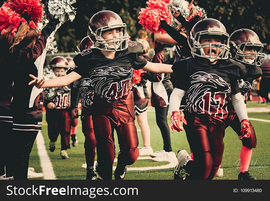 Children in White and Red Football Outfit