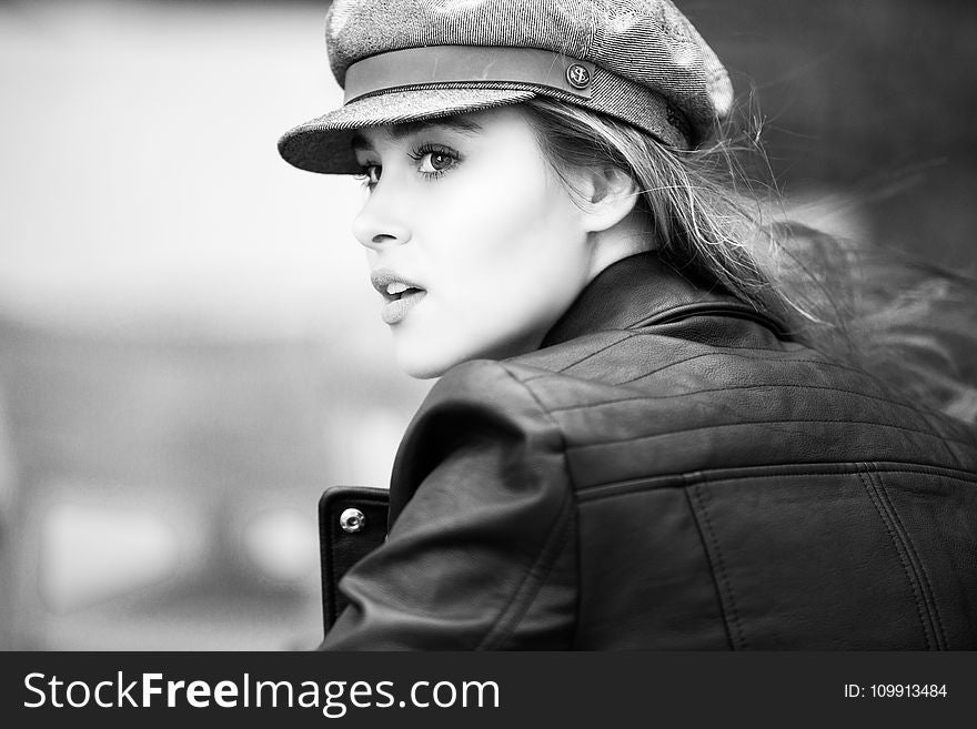 Grayscale Photo of Woman in Black Leather Jacket