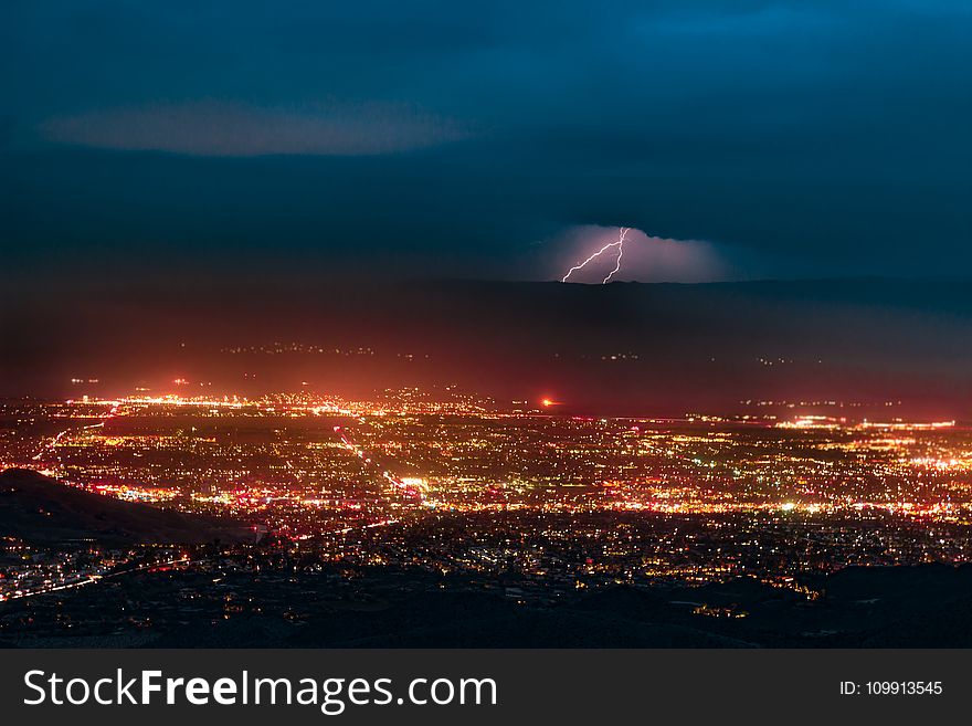 Aerial Photography of Urban City Overlooking Lightning during Nighttime