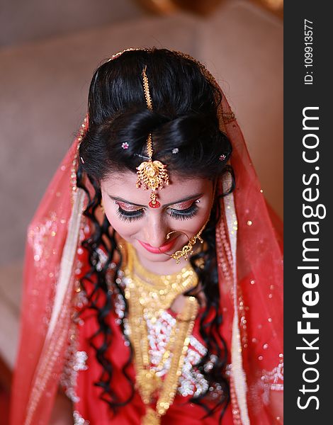 Woman Wearing Red and White Sari