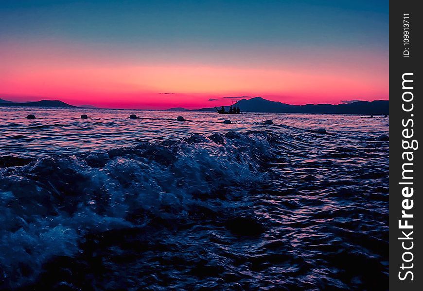 Person Taking Photo of Body of Water in Long Exposure Shot