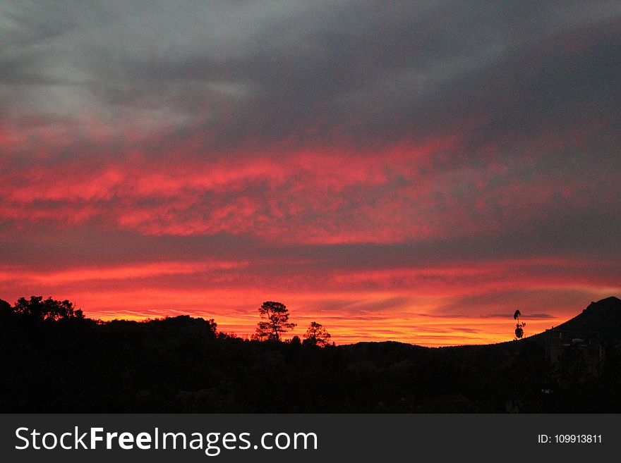 Mountain Under Red and Gray Cloudy Sky during Golden Hou