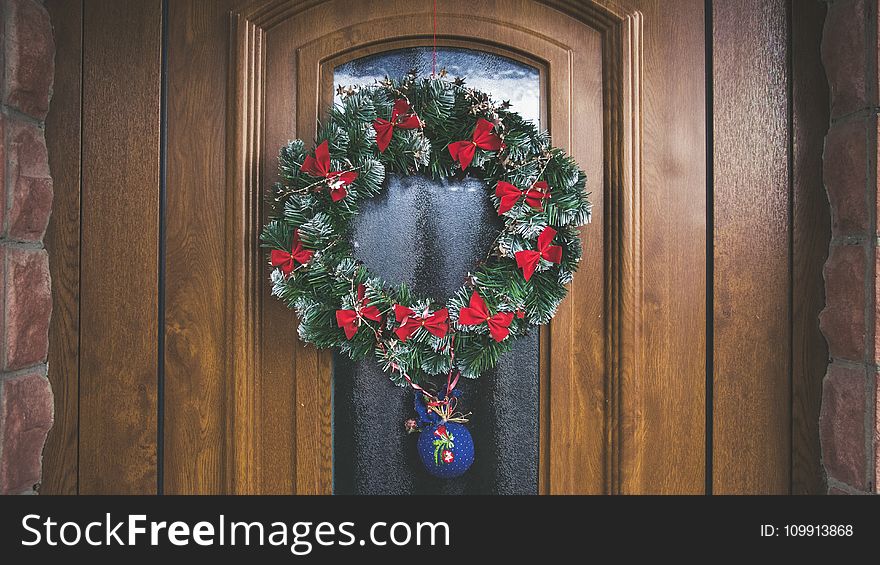 Green And Red Christmas Wreath On Door