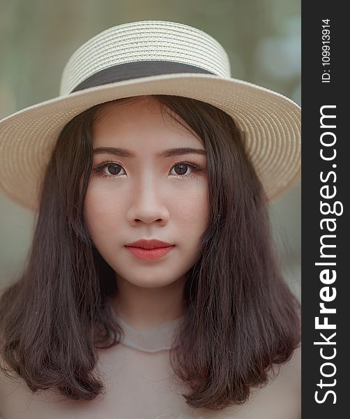 Woman Wearing Brown Bucket Cap