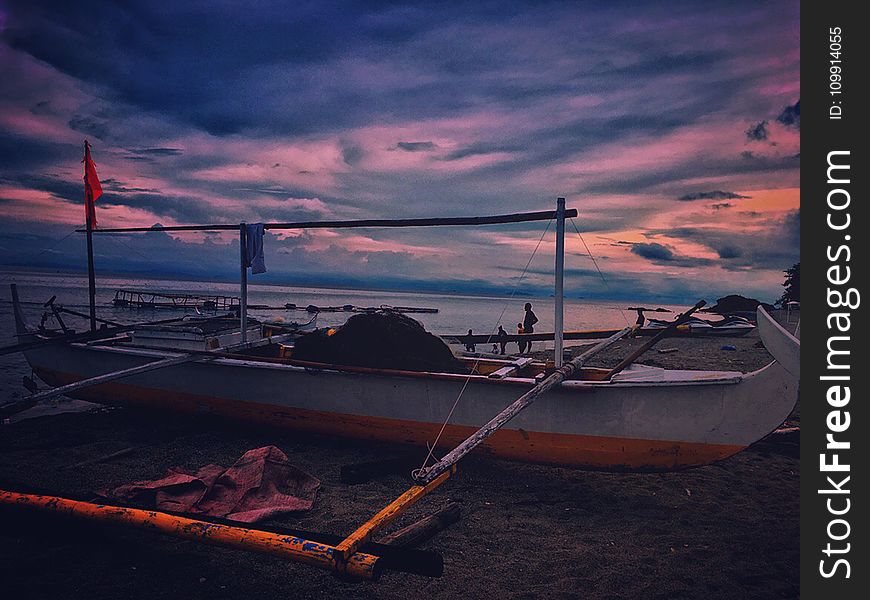 White Fishing Boat during Dawn