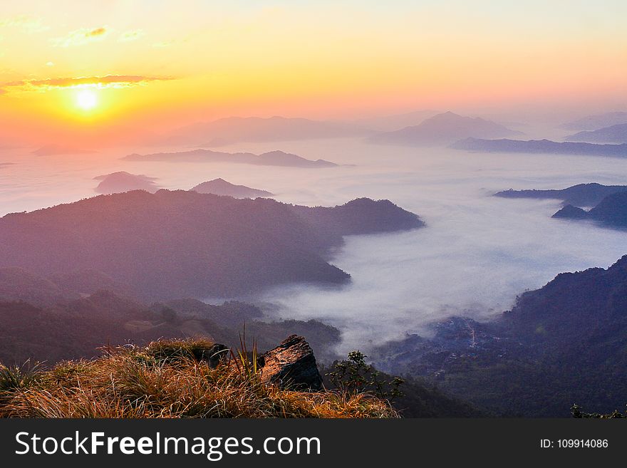 Sun Rise With Mountain and Green Grass