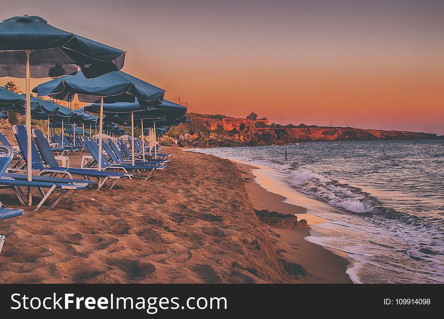 House And Parasols Near Beach