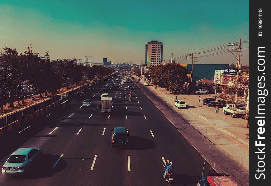 Cars In Black Concrete Road In Landscape Photography