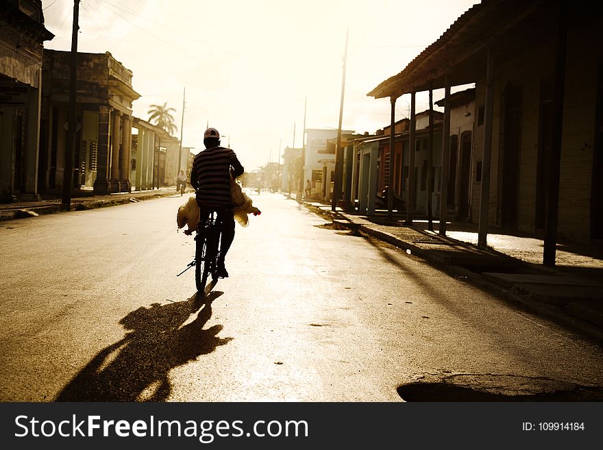 Person Riding on Bike Photo Shot during Daylight