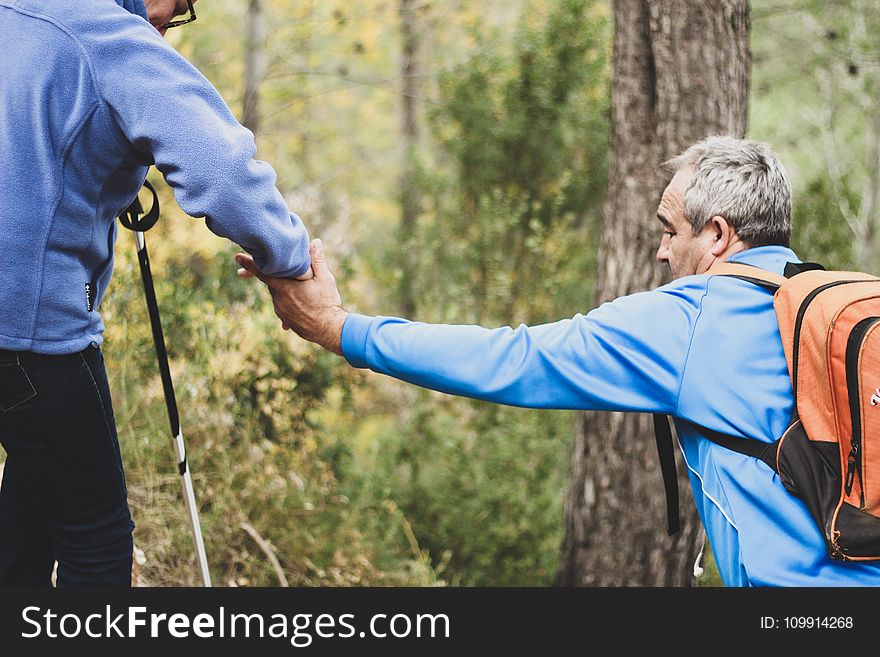 Photo of Two Old Man Helping Each Other
