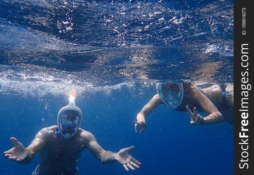 Photo Of People Snorkeling Underwater