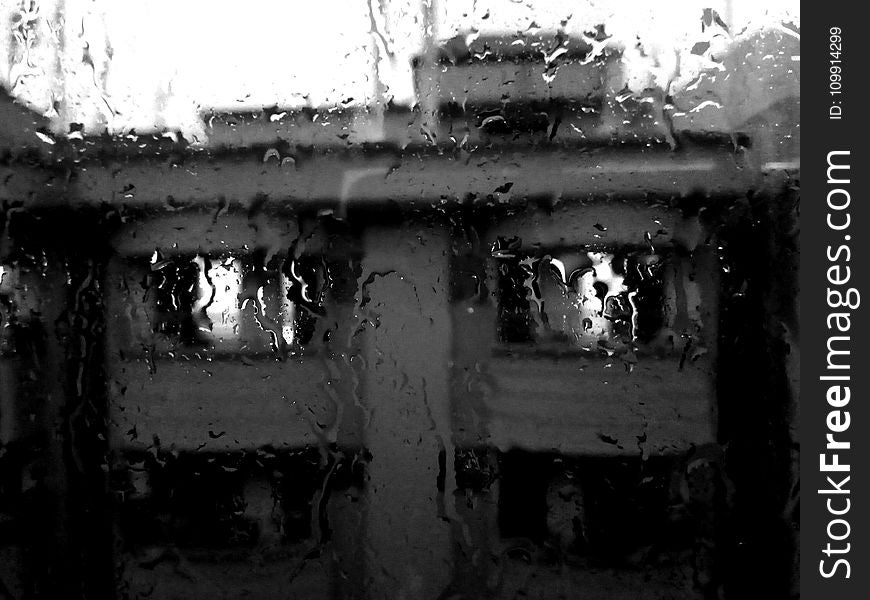 Rain Pouring on Glass Window