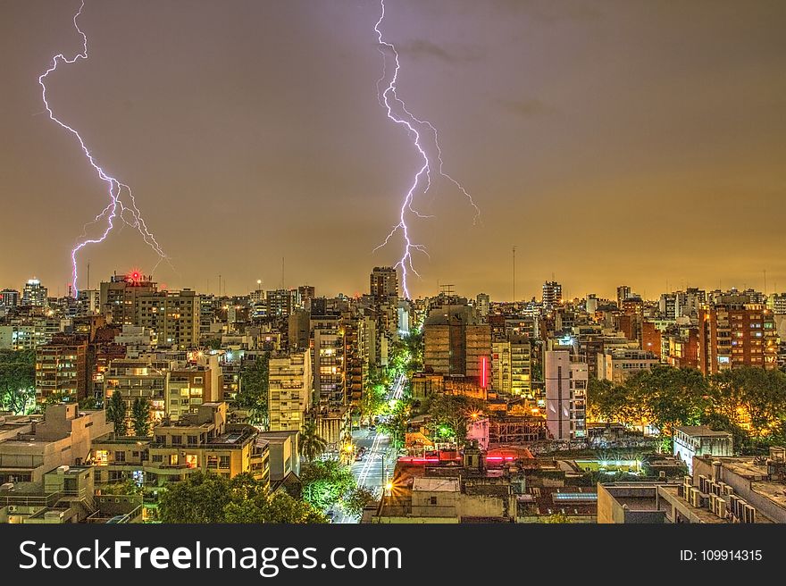 Photography of Thunder Strike Behind City