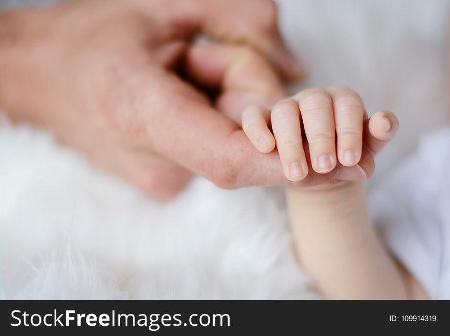 Baby Holding It&#x27;s Parent Finger