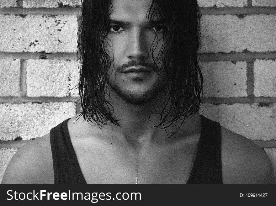 Black And White Photo Of Man In Tank Top