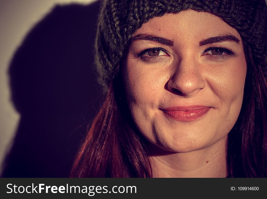 Woman Wearing Black Beanie Smiling for Photo