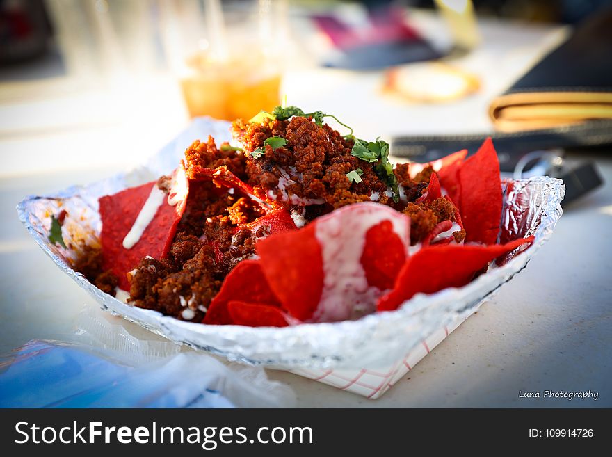 Food Photography of Shredded Flakes and Red Chips Top With Parsley