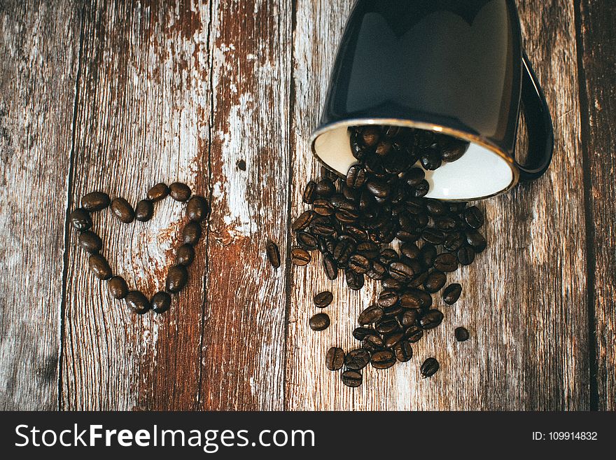 Black Ceramic Coffee Mug and Beans