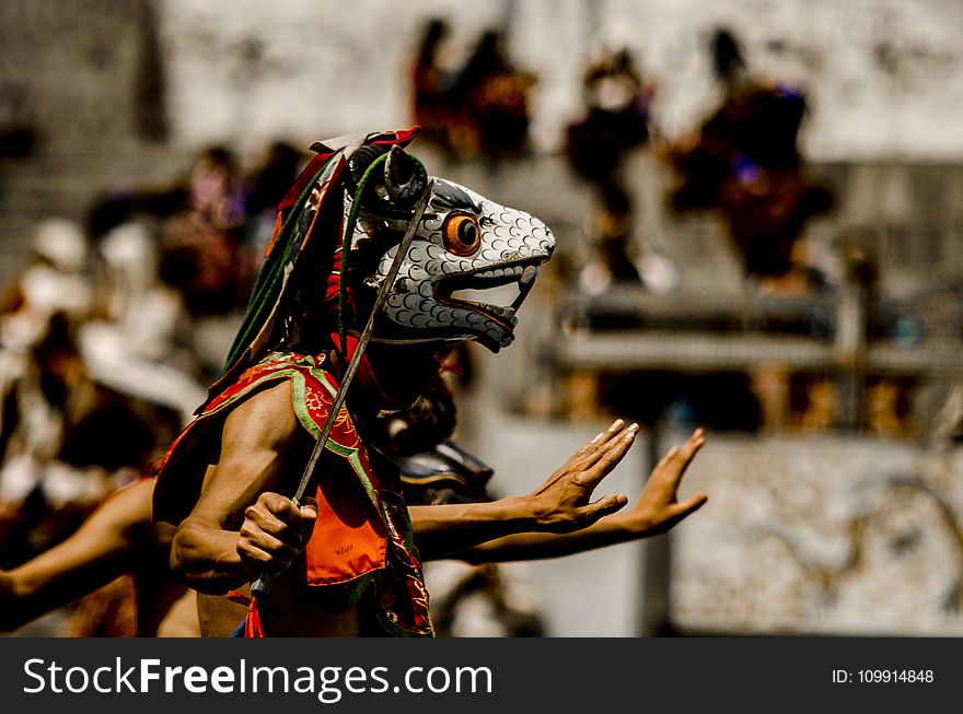 Person Wearing Traditional Mask Dancing